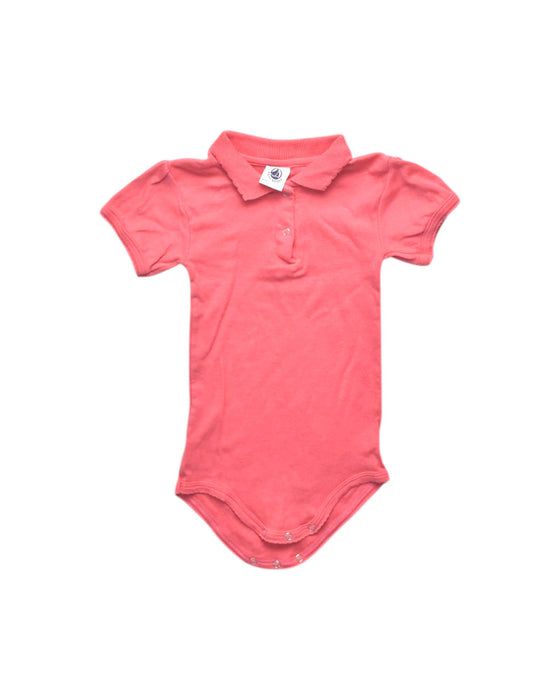 A Pink Short Sleeve Bodysuits from Petit Bateau in size 12-18M for girl. (Front View)