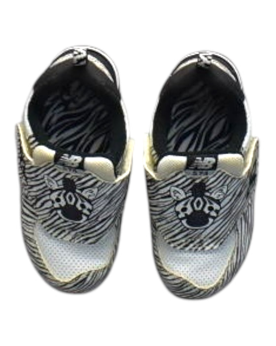 A Black Sneakers from New Balance in size 18-24M for boy. (Back View)