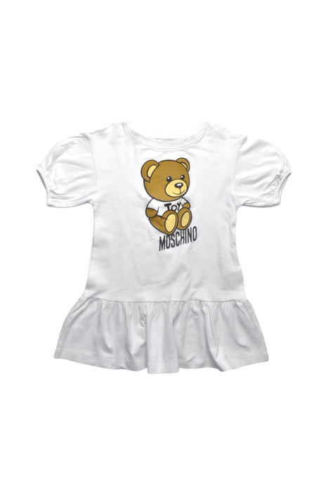 A White Short Sleeve Dresses from Moschino in size 4T for girl. (Front View)