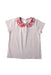 A White Short Sleeve Tops from Jacadi in size 4T for girl. (Front View)
