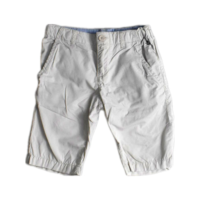 A White Shorts from Petit Bateau in size 5T for boy. (Front View)