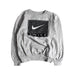 A Grey Crewneck Sweatshirts from Nike in size 8Y for boy. (Front View)