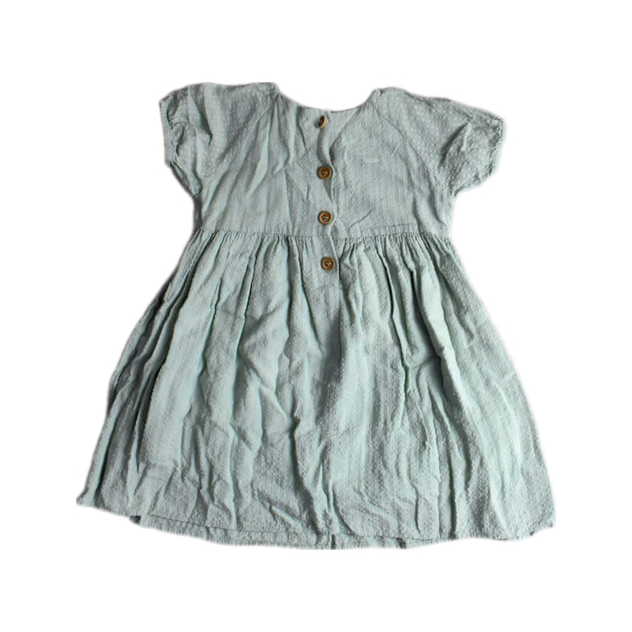 A Green Short Sleeve Dresses from Our Mini Nature in size 4T for girl. (Back View)