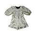 A Silver Long Sleeve Rompers from Stella McCartney in size 6T for girl. (Front View)