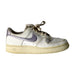 A White Sneakers from Nike in size 12Y for girl. (Front View)