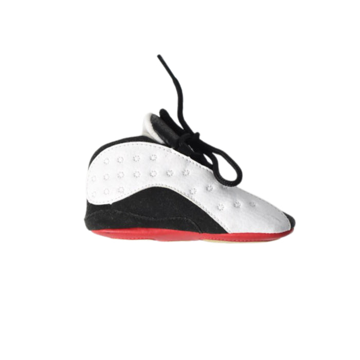 A White Sneakers from Air Jordan in size 12-18M for boy. (Front View)