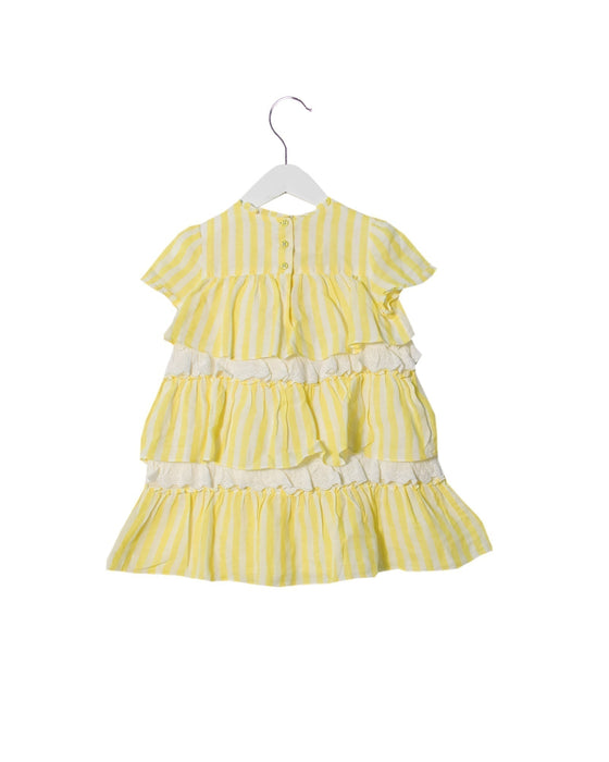 A White Short Sleeve Dresses from Nanos in size 4T for girl. (Back View)