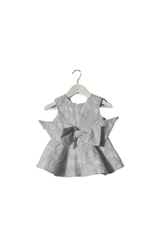 A White Sleeveless Dresses from bloomB in size 6-12M for girl. (Front View)