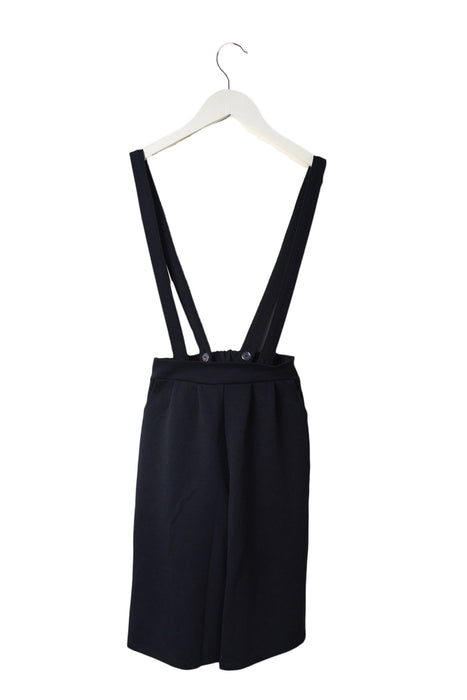 A Navy Long Overalls from Lindomono in size 4T for girl. (Back View)