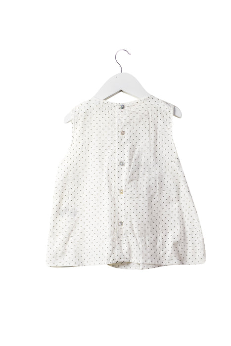 A White Sleeveless Tops from Laranjinha in size 4T for girl. (Back View)
