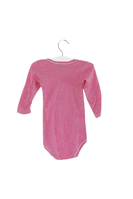 A Pink Long Sleeve Bodysuits from Petit Bateau in size 6-12M for girl. (Front View)