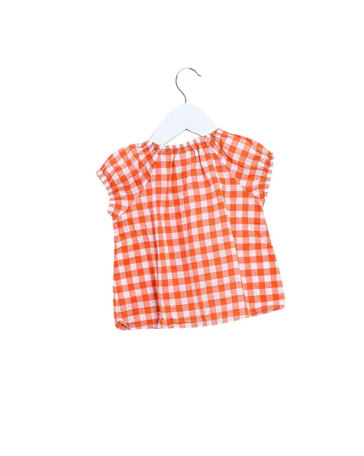A Orange Short Sleeve Tops from DPAM in size 3-6M for girl. (Front View)